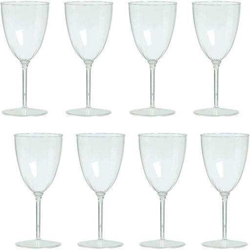 Set of eight clear wine glasses on a white background