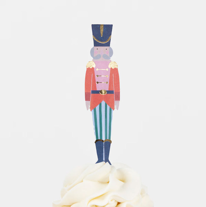 Colorful toy soldier cupcake topper on a white background