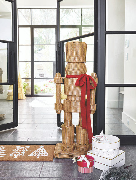 All Weather Rattan Nutcracker with Red Velvet Bow