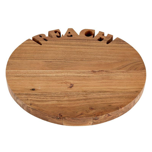 Wooden round sign with 'BEACH' cut out of the top. Handcrafted acacia wood tray with ‘BEACH’ lettering, styled with summer appetizers and coastal table accessories.