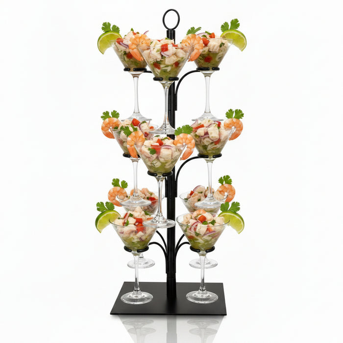 Decorative glass stand with champagne flutes filled with orange juice on a white background