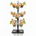 Decorative glass stand with champagne flutes filled with orange juice on a white background