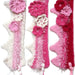 Pink and cream princess crochet wool crown with floral details and ribbon ties for little girls
