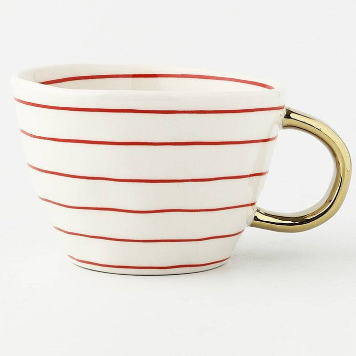 White mug with red stripes and a gold handle on a white background