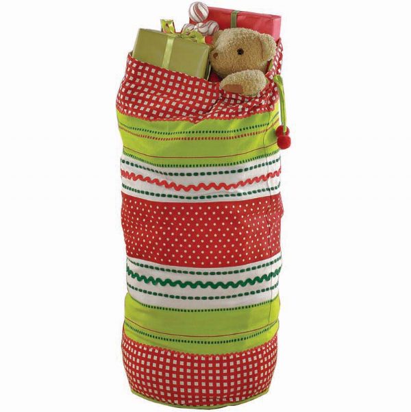 A retro extra large holiday sack with red and green stripes and polka dots, containing gift items and tied with a ribbon.