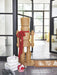 Large all-weather rattan wicker nutcracker with red satin ribbon styled in a home entryway — coastal and preppy Christmas holiday decor for indoor and outdoor display