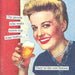Anne Taintor cocktail napkin closeup, retro blonde woman holding beer with humorous cap