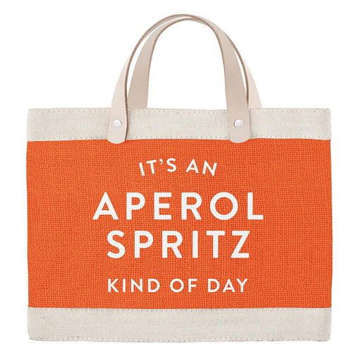 Orange tote bag with white text 'It's an Aperol Spritz kind of day' on a white background