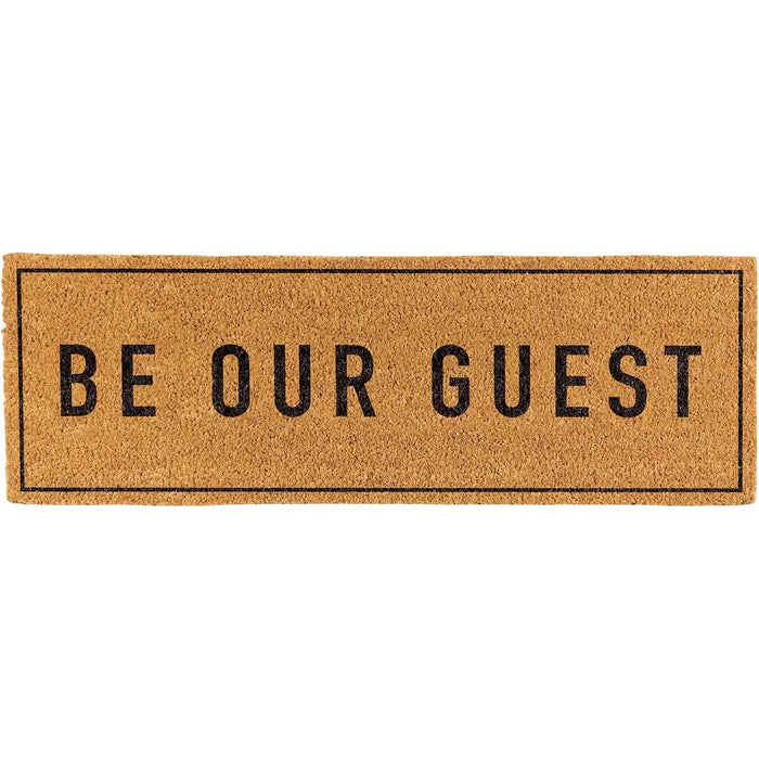 Doormat with 'Be Our Guest' text on a white background