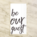 Paper napkins with the saying 'be our guest' text on a marble background