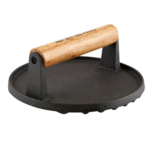 A black cast iron meat press with a beechwood handle.