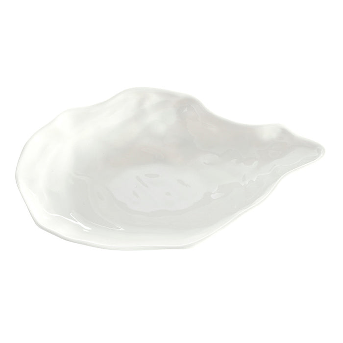 White ceramic leaf-shaped dish on a white background