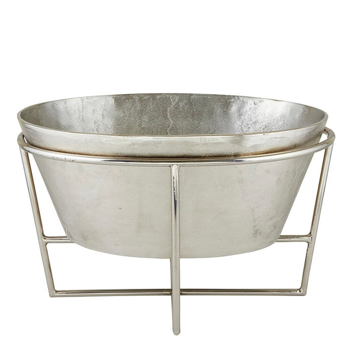 Metallic silver ice bucket with stand on a white background
