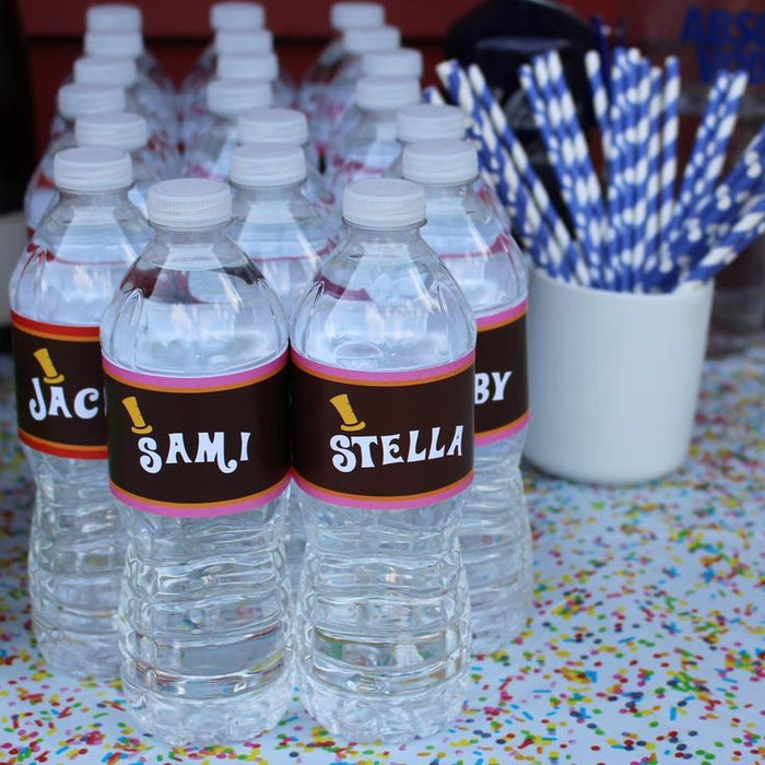 Personalized Chocolate Factory water bottle wraps in dark red and gold with custom names, displayed on water bottles with blue striped straws