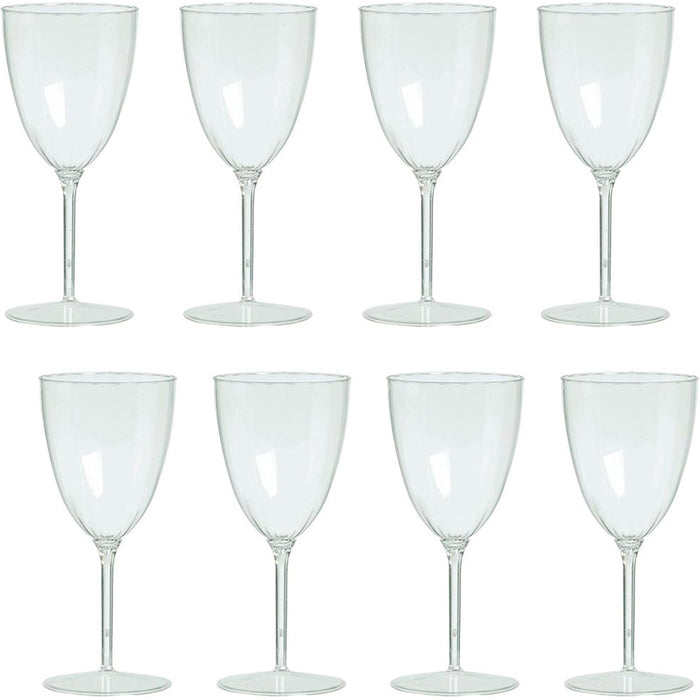 Set of eight clear wine glasses on a white background