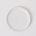 White ceramic plate on a light gray background