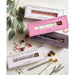 Essential oil diffuser pens in various scents with packaging on a light surface.