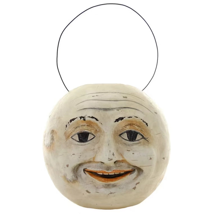 Vintage-style cream paper mâché moon face candy bucket with wire handle