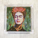 Frida lunch paper napkins featuring Frida Kahlo with a vibrant floral headpiece in a green background