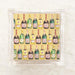 Pack of cocktail paper napkins with printed champagne bottles on them, presented in a clear packaging.
