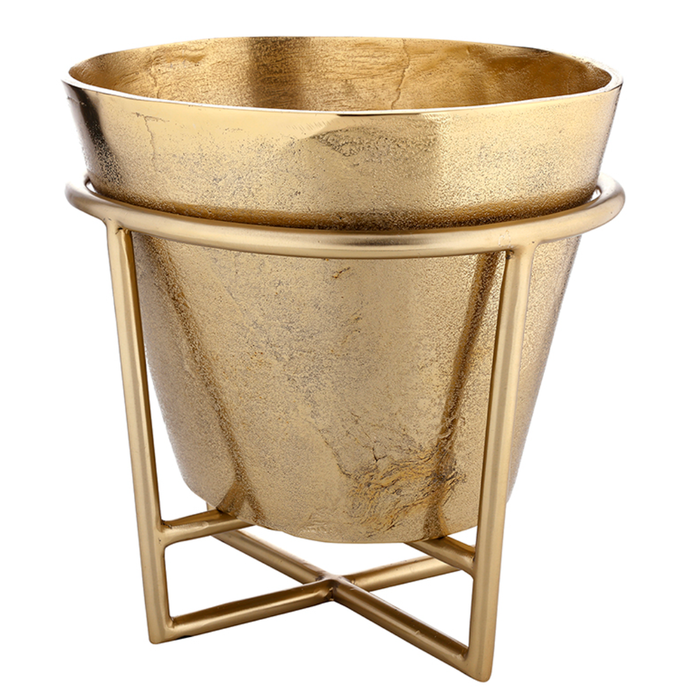 Gold metal planter with decorative stand on a white background