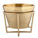 Gold metal planter with decorative stand on a white background