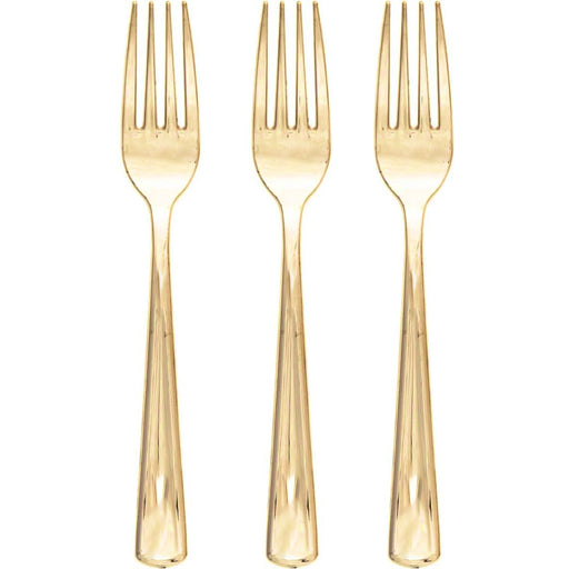 Three gold forks on a white background