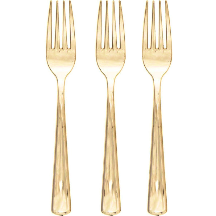 Three gold forks on a white background