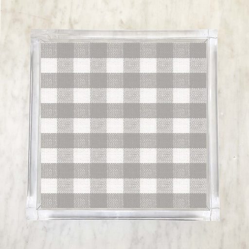 A checkered grey and white patterned paper napkin displayed on a surface.