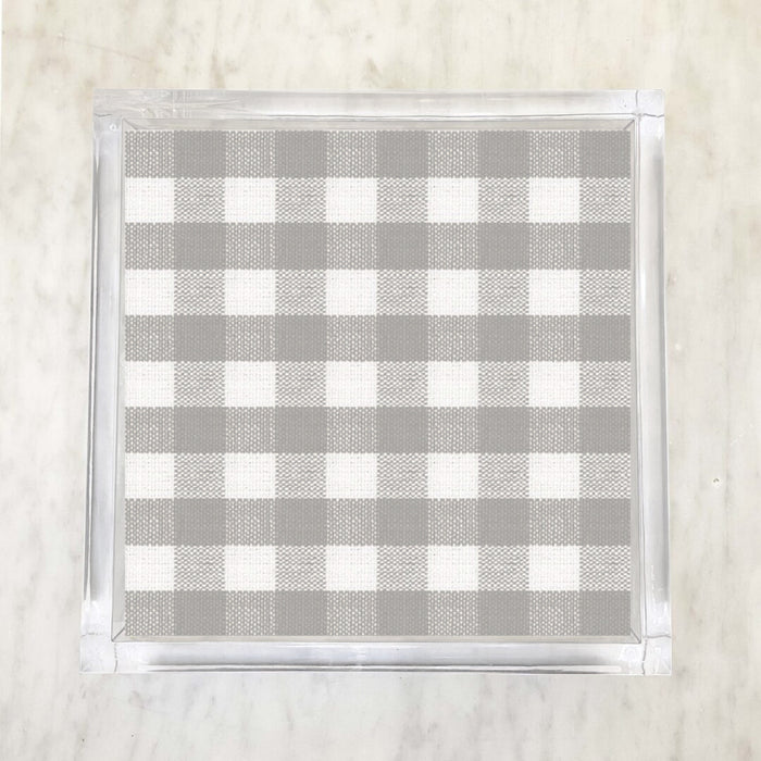 A checkered grey and white patterned paper napkin displayed on a surface.