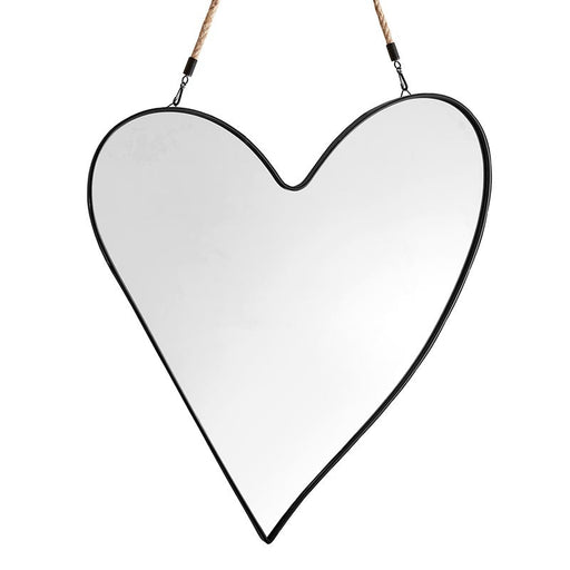 Heart-shaped mirror with black frame hanging on a white background