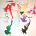 Colorful paper cutouts of dancers in various costumes on a white background