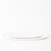Two white ceramic plates stacked on a white background
