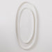 White oval mirror on a light gray background