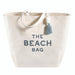 Large canvas beach tote bag with leather handles and tassel detail, THE BEACH BAG lettering