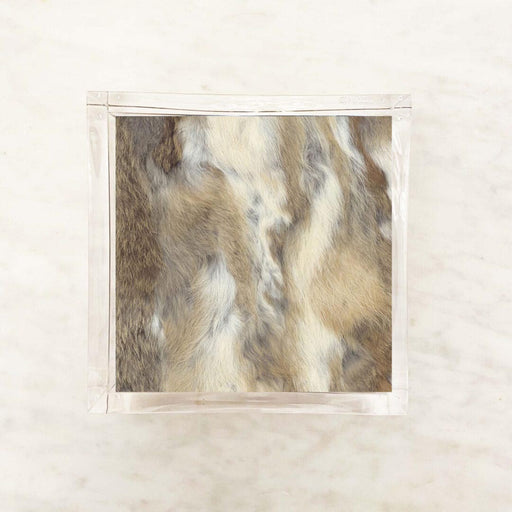 A packet of luxury fur cocktail paper napkins displayed against a marble background.
