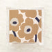 Marimekko Unikko poppy floral luncheon napkins in tan and navy — iconic Finnish design for stylish entertaining, dinner parties, and hostess gifts