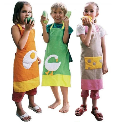 Three children wearing colorful aprons with cartoon designs on a white background