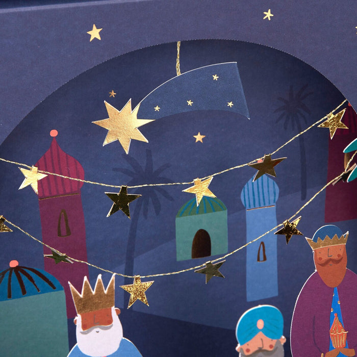 Illustration of three wise men and a star on a blue background