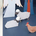 Nativity Advent Calendar paper craft kit with fold-out characters, animals, stable, shooting star, and gold foil details for a Christmas countdown display. Cardboard cutouts of sheep and a rooster on a blue background