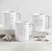 Ocean Child matte white ceramic mug styled on white surface
