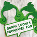 Green Oompa Loompa hair and "Oompa Loompa Doompadee Doo" speech bubble photo booth props on wooden dowels — perfect for Willy Wonka and Charlie and the Chocolate Factory themed parties