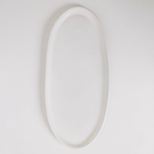 White oval plate on a light gray background