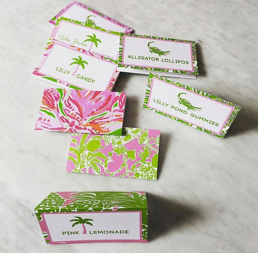 A collection of Palm Beach food tents with various designs, including text and illustrations such as palm leaves and alligators. The tents are displayed on a neutral background.