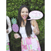 Woman holding printable Palm Beach party props including a pink and green pineapple and a custom speech bubble reading "Pinch me it's Summer"