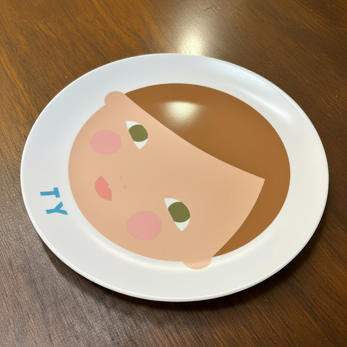 Personalized melamine plate with a boy face illustration. 