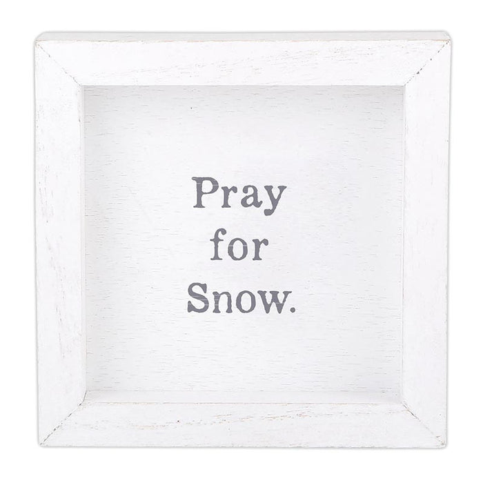 White framed sign with 'Pray for Snow' text on a white background