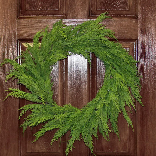 Realistic cedar wreath with faux cedar branches and natural twig base for