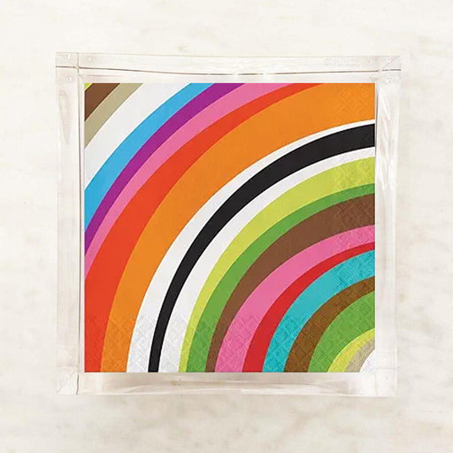 Colorful striped rainbow napkins on a textured surface