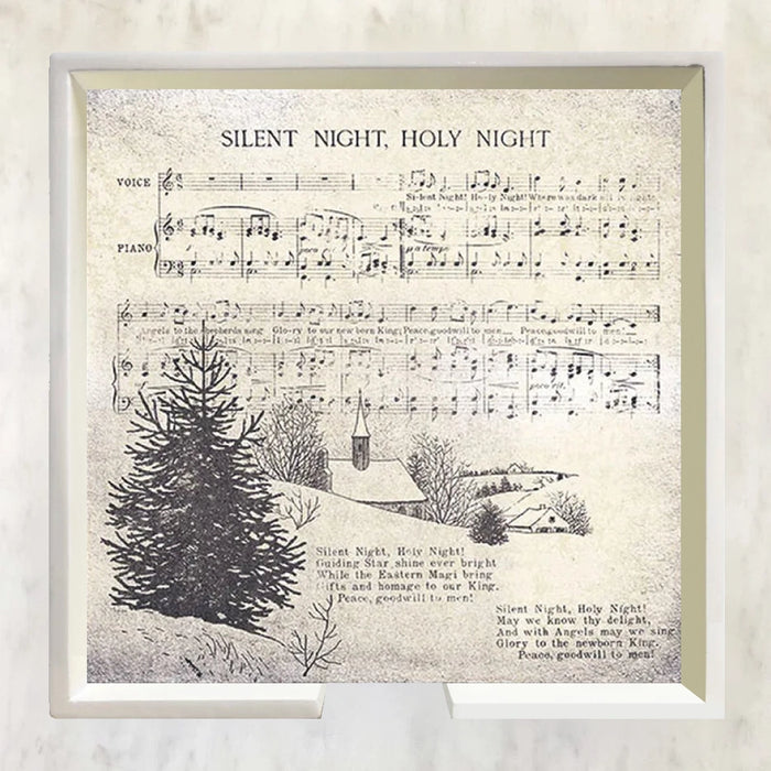 Sheet music for 'Silent Night, Holy Night' with a Christmas scene illustration on a textured background.